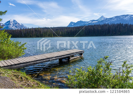 Wooden dock on the lake shore. Leach Lake, Jasper National Park. Alberta, Canada. Canadian Rockies summer landscape. 121584865