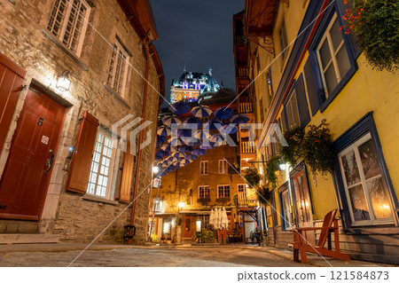 Quebec, Canada - October 18 2021 : Umbrella Alley. Quebec City Old Town street view in autumn night. 121584873