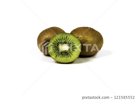 Two whole kiwi and half a cut kiwi closeup 121585552