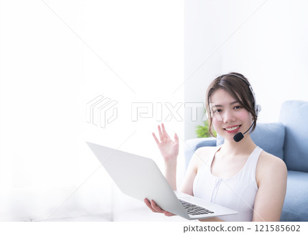 Young woman delivering yoga lessons from home Young woman delivering yoga lessons from home 121585602