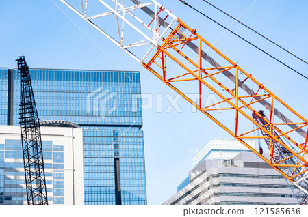 Construction site crane and blue sky 121585636
