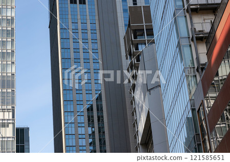 Skyscrapers seen from between buildings 121585651