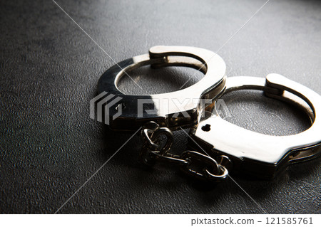 Handcuffs, arrest, police, crime image Handcuffs, arrest, police, crime image 121585761