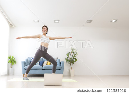 Young woman delivering yoga lessons Young woman delivering yoga lessons 121585918