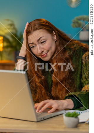Frustrated business woman having software problems with laptop error or mistake virus notification Frustrated business woman having software problems with laptop error or mistake virus notification 121586130