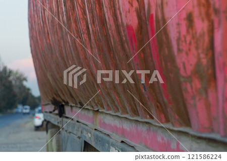 Old Cargo Commercial Metal Container Swollen At The Edges Of The Wall From Excessive Load, Degree Of Deformation, Improper Dangerous Maintenance Of Vehicles, Violation Of Loading Rules 121586224