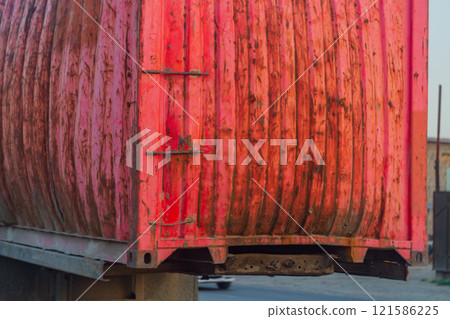 Commercial Old Cargo Metal Container Swollen At The Edges Of Wall From Excessive Load, Degree Of Deformation, Improper Dangerous Maintenance Of Vehicles, Violation Of Loading Rules. 121586225