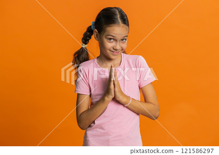 Sneaky cunning child girl kid thinking over devious villain idea, cheats, jokes, pranks, evil plan 121586297