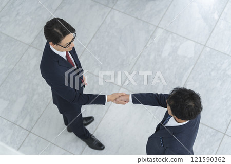 Two businessmen shaking hands 121590362