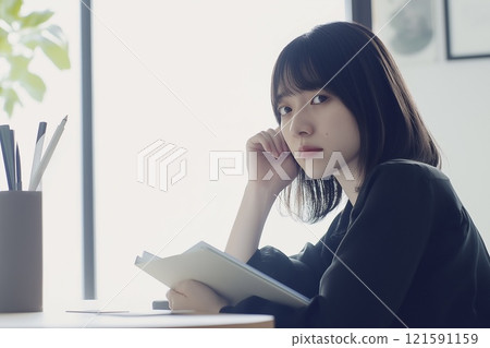 A woman smiling at the camera 121591159