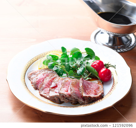 Roast beef cut and arranged on a plate Roast beef cut and arranged on a plate 121592096