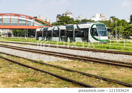 The circular light rail train drives past Hamasen Railway Cultural Park in Kaohsiung, Taiwan. The circular light rail train drives past Hamasen Railway Cultural Park in Kaohsiung, Taiwan. 121593624