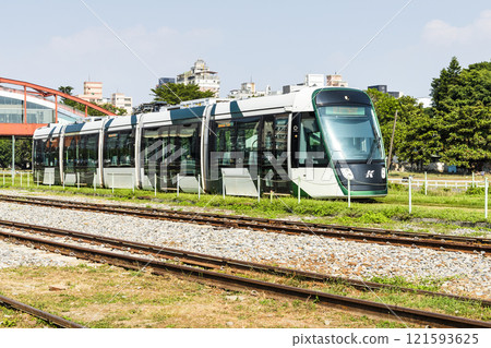 The circular light rail train drives past Hamasen Railway Cultural Park in Kaohsiung, Taiwan. The circular light rail train drives past Hamasen Railway Cultural Park in Kaohsiung, Taiwan. 121593625