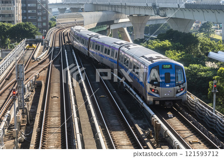 View of a Taoyuan International Airport line train running on the elevated track of the Taoyuan Mass Rapid Transit System. View of a Taoyuan International Airport line train running on the elevated track of the Taoyuan Mass Rapid Transit System. 121593712