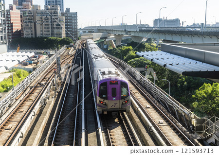 View of a Taoyuan International Airport line train running on the elevated track of the Taoyuan Mass Rapid Transit System. 121593713