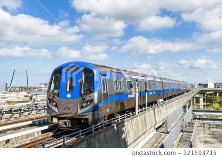 View of a Taoyuan International Airport line train running on the elevated track of the Taoyuan Mass Rapid Transit System. 121593715