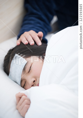 Image of a mother nursing her child's cold 121593885