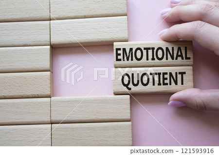 Emotional Quotient symbol. Wooden blocks with words Emotional Quotient. Businessman hand. Beautiful pink background. Business and Emotional Quotient concept. Copy space. Emotional Quotient symbol. Wooden blocks with words Emotional Quotient. Businessman hand. Beautiful pink background. Business and Emotional Quotient concept. Copy space. 121593916
