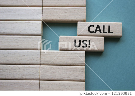 Call Us symbol. Wooden blocks with words Call Us. Beautiful grey green background. Business and Call Us concept. Copy space. 121593951