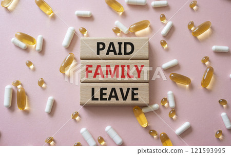 Paid Family Leave symbol. Concept words Paid Family Leave on wooden blocks. Beautiful pink background with pills. Healthcare and Paid Family Leave concept. Copy space. Paid Family Leave symbol. Concept words Paid Family Leave on wooden blocks. Beautiful pink background with pills. Healthcare and Paid Family Leave concept. Copy space. 121593995