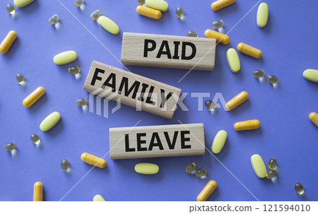 Paid Family Leave symbol. Concept words Paid Family Leave on wooden blocks. Beautiful purple background with pills. Healthcare and Paid Family Leave concept. Copy space. Paid Family Leave symbol. Concept words Paid Family Leave on wooden blocks. Beautiful purple background with pills. Healthcare and Paid Family Leave concept. Copy space. 121594010
