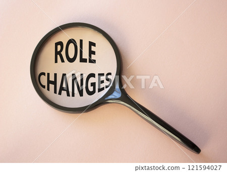 Role changes symbol. Concept words Role changes on magnifying glass. Beautiful pink background. Business and Role changes concept. Copy space. Role changes symbol. Concept words Role changes on magnifying glass. Beautiful pink background. Business and Role changes concept. Copy space. 121594027