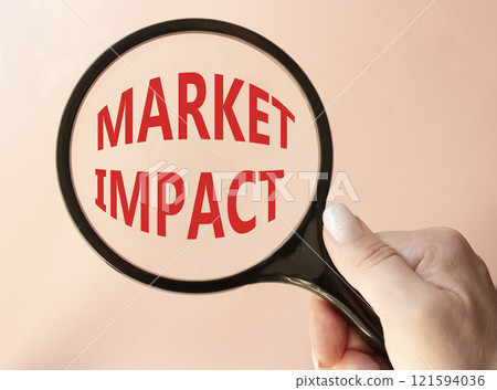 Market impact. Concept word Market impact on magnifying glass. Beautiful pink background. Businessman hand. Business and Market impact concept. Copy space. Market impact. Concept word Market impact on magnifying glass. Beautiful pink background. Businessman hand. Business and Market impact concept. Copy space. 121594036