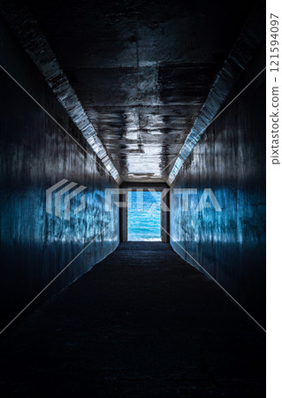 At the end of the dark tunnel you can see the ocean, 121594097