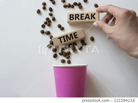 Break Time symbol. Concept word Break Time on wooden blocks. Beautiful white background with coffee cup. Businessman hand. Business and Break Time concept. Copy space Break Time symbol. Concept word Break Time on wooden blocks. Beautiful white background with coffee cup. Businessman hand. Business and Break Time concept. Copy space 121594218