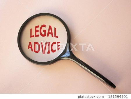 Legal advice symbol. Magnifying glass with words Legal advice. Beautiful pink background. Business and Legal advice concept. Copy space. 121594301