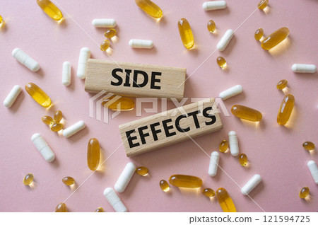 Side Effects symbol. Wooden blocks with words Side Effects. Beautiful pink background with pills. Medicine and Side Effects concept. Copy space. Side Effects symbol. Wooden blocks with words Side Effects. Beautiful pink background with pills. Medicine and Side Effects concept. Copy space. 121594725
