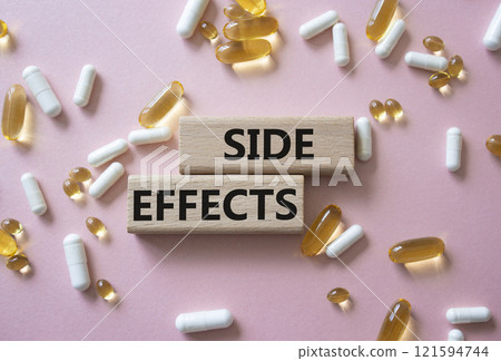 Side Effects symbol. Wooden blocks with words Side Effects. Beautiful pink background with pills. Medicine and Side Effects concept. Copy space. Side Effects symbol. Wooden blocks with words Side Effects. Beautiful pink background with pills. Medicine and Side Effects concept. Copy space. 121594744