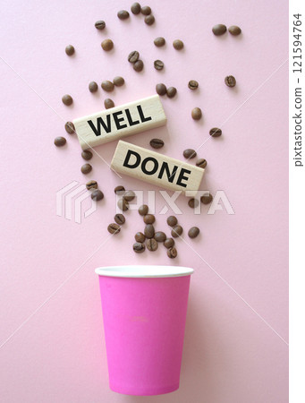 Well done symbol. Concept word Well done on wooden blocks. Beautiful pink background with coffee cup. Business and Well done concept. Copy space 121594764
