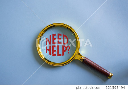 Need Help symbol. Magnifying Glass with Concept word Need Help. Beautiful blue background. Business and Need Help concept. Copy space 121595494