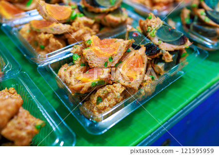 Top view of Fried Salted Egg Wrapped With Curried Fish Cake, focus selective 121595959