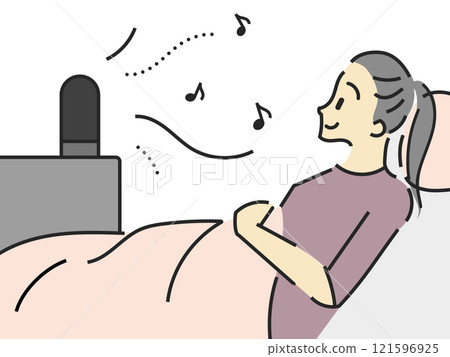 Woman lying down listening to music 121596925