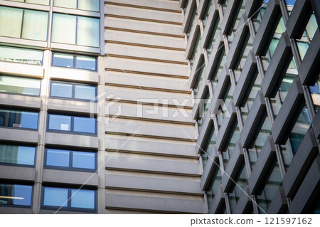 Modern high-rise buildings. Building facade. Concrete and glass 121597162