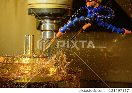 The CNC milling machine cutting the shell mold parts with oil coolant method. 121597517