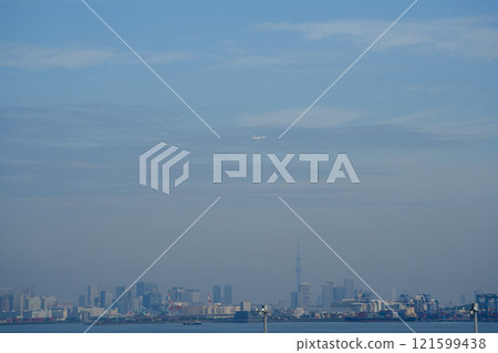 A passenger plane flying over Tokyo A passenger plane flying over Tokyo 121599438