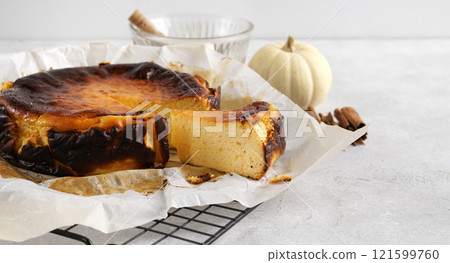 Cut piece of Delicious homemade Pumpkin Basque Cheesecake, copy space Cut piece of Delicious homemade Pumpkin Basque Cheesecake, copy space 121599760