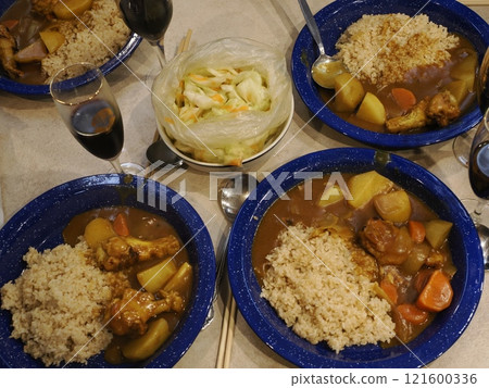 Camping food in a trailer: curry rice and red wine Camping food in a trailer: curry rice and red wine 121600336