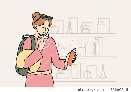 Woman inhales aroma of perfume, stands near counter of store selling cosmetics and expensive perfume Woman inhales aroma of perfume, stands near counter of store selling cosmetics and expensive perfume 121600846
