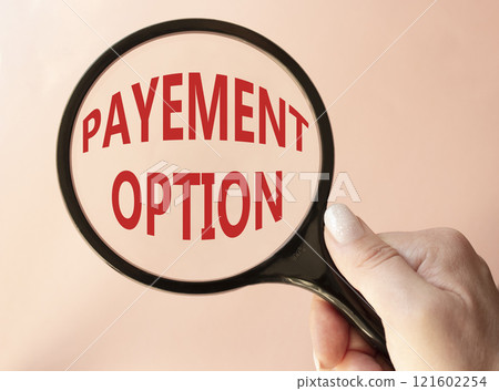 Payment Options symbol. Concept words Payment Options on magnifying glass. Businessman hand. Beautiful pink background. Business and Payment Options concept. Copy space. 121602254