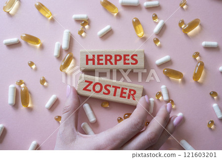 Herpes Zoster symbol. Concept word Herpes Zoster on wooden blocks. Beautiful pink background with pills. Doctor Hand. Medicine and Herpes Zoster concept. Copy space Herpes Zoster symbol. Concept word Herpes Zoster on wooden blocks. Beautiful pink background with pills. Doctor Hand. Medicine and Herpes Zoster concept. Copy space 121603201