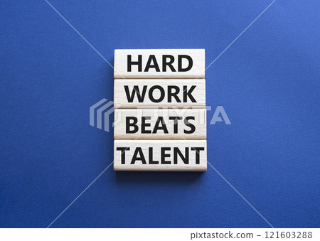 Talent symbol. Concept words Hard work beats talent on wooden blocks. Beautiful deep blue background. Business and Hard work beats talent concept. Copy space Talent symbol. Concept words Hard work beats talent on wooden blocks. Beautiful deep blue background. Business and Hard work beats talent concept. Copy space 121603288
