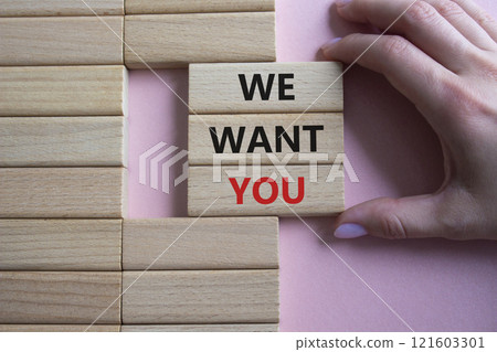 We want you symbol. Concept words We want you on wooden blocks. Businessman hand. Beautiful pink background. Business and We want you concept. Copy space. 121603301