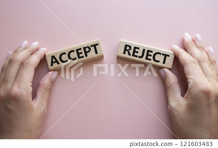 Accept or Reject symbol. Concept word Accept or Reject on wooden blocks. Businessman hand. Beautiful pink background. Business and Accept or Reject concept. Copy space 121603483