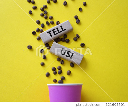 Tell us symbol. Concept words Tell us on wooden blocks. Beautiful yellow background with coffee cup. Business and Tell us concept. Copy space. Tell us symbol. Concept words Tell us on wooden blocks. Beautiful yellow background with coffee cup. Business and Tell us concept. Copy space. 121603501