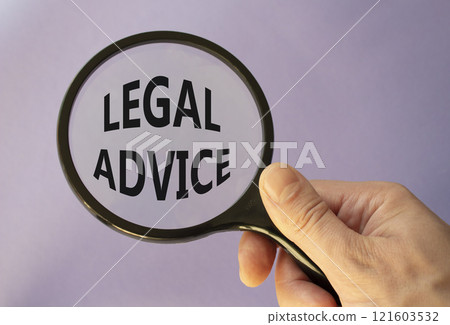 Legal advice symbol. Magnifying glass with words Legal advice. Businessman hand. Beautiful purple background. Business and Legal advice concept. Copy space. 121603532