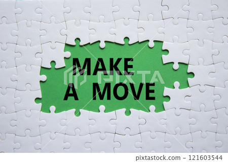 Make a Move symbol. Concept word Make a Move on white puzzle. Beautiful green background. Business and Make a Move concept. Copy space Make a Move symbol. Concept word Make a Move on white puzzle. Beautiful green background. Business and Make a Move concept. Copy space 121603544